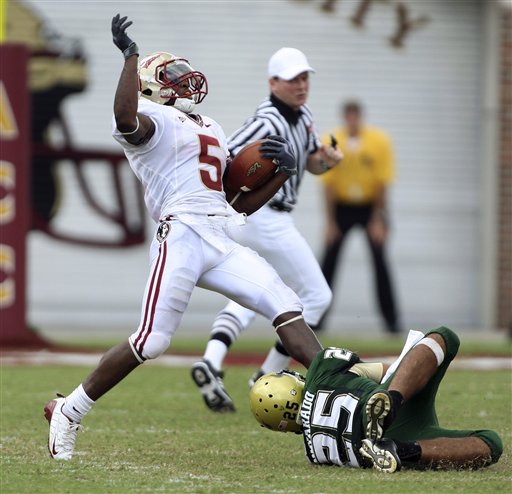  Delbert Alavarado   (25)  makes  a   successful  last  ditch  attempt    to  tackle    Florida  State's Greg  Reid   on   his   kick  off  return  which    but  for   the attempt   by   Alvarado  would've   resulted   in a  touchdown.     Alvarado's   play  highlighted some  of  the bad  luck  that   befell the    Seminoles.        picture appears  courtesy    of  ap/photo/ Phil  Coale  ...................................