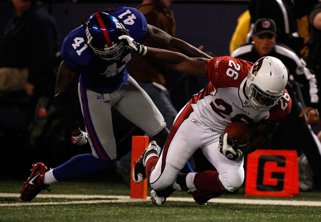 Chris  'Beanie' Wells (26) of   the   Cardinals   scrambles   for  the   touchdown  against  the  NY  Giants   at    Giants  Stadium  in  East  Rutherford ,  New  Jersey    on   Sunday  night.     picture   appears  courtesy  of   getty  images/ Jared  Wichham   ................  