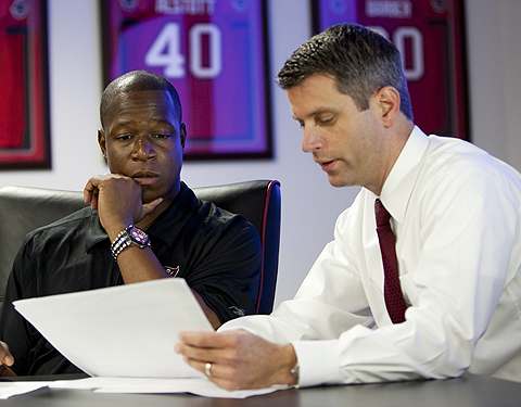 Tampa Bay Buccaneers Head Coach Raheem Morris and General Manager Mark Dominik discuss the Buccaneers first round selection in the draft room at One Buccaneer Place on Saturday, April 25, 2009, in Tampa, Florida. Photo by Matt May/Tampa Bay Buccaneers