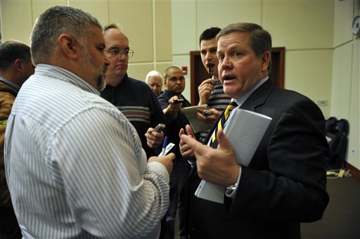 Notre Dame head football coach Brian Kelly talks to reporters after his press conference about prospective student-athletes who have signed and submitted their letter of intent to Notre Dame on national signing day, Wednesday, Feb. 3, 2010 in South Bend, Ind.  photo  appears courtesy  of  Associated  Press/ Joe Raymond ......