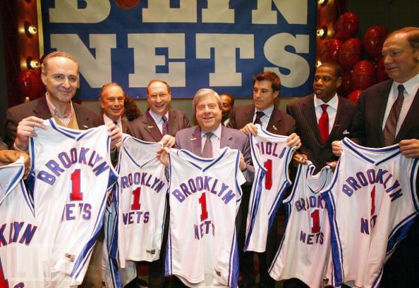 <strong> Bruce  Ratner </strong> (right) (former  principal partnership  owner of  the New Jersey  Nets) seen here   alongside  New York Mayor <strong> Michael  Bloomberg</strong> (left)  in  the  background  .  Also  pictured  is <strong> rapper  and  <em> entertaiment  mogul </em>  Jay-z </strong> ,  a  minority   stakeholder   in  the   NBA  franchise.   photo appears  courtesy  of   Associated  Press /   Matt  Richardson  .................