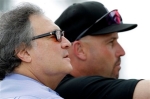 Florida Marlins owner Jeffrey Loria, left, watches batting practice with Marlins manager Fredi Gonzalez during spring training baseball Wednesday, Feb. 24, 2010, in Jupiter, Fla. With the smallest payroll in the majors last year, the Marlins won 87 games and finished six games behind eventual league champion Philadelphia in the NL East. Visiting spring training to watch the first full-squad workout, Loria said the 2009 Marlins underachieved. photo appears courtesy of Assoc Press/Jeff Roberson ........