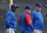 Chicago Cubs manager Lou Piniella, right, along with coaches Matt Sinatro, middle, and Lester Strode watch pitchers warm up during spring training baseball camp practice Saturday, Feb. 20, 2010, in Mesa, Ariz. photo appears courtesy of Assoc. Press/ Ross D. Franklin ...........