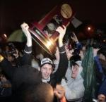 Butler's Nick Rodgers hold up the West Regional trophy as the team returned home to Indianapolis amid a throng of fans after earning a spot in the Final Four with a victory over Kansas State Saturday.