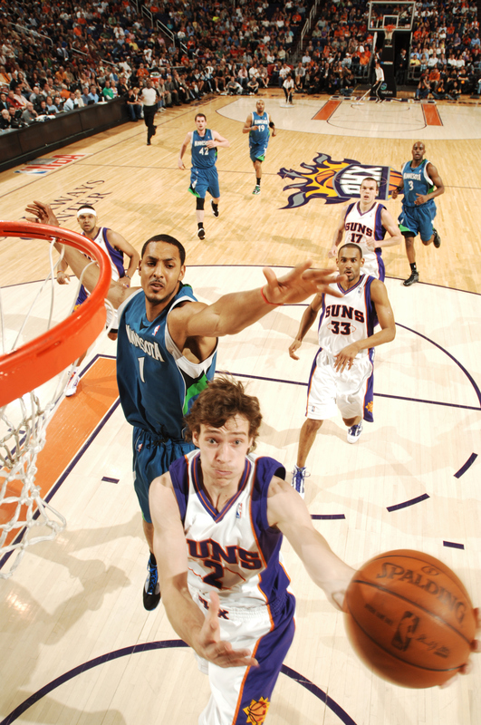 Goran Dragic (2) of the Phoenix Suns drives for a shot past Ryan Hollins (1) of the Minnesota Timberwolves in an NBA Game played on March 16, 2010 at U.S. Airways Center in Phoenix, Arizona. photo appears  courtesy of  NBAE/ Getty  Images/  Barry  Gossage  ......................