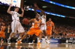 St. Louis , Bobby Maze (3) of the Tennessee Volunteers looks to shoot the ball against Mike Kebler (20) and Draymond Green (23) both of the Michigan State Spartans during the midwest regional final of the 2010 NCAA men's basketball tournament at the Edward Jones Dome on March 28, 2010 in St. Louis, Missouri. Michigan State beat Tennessee 70-69. photo appears courtesy of Getty Images/ Dilip Vishwanat ...