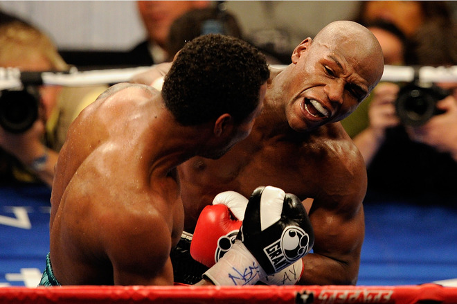 <font face="new times roman" size="3">  Floyd Mayweather Jr. throws a right to the body of Shane Mosley during the welterweight fight at the MGM Grand Garden Arena on May 1, 2010 in Las Vegas, Nevada.   Getty  Images/  Ethan  Miller  </font> 
