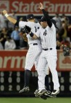 Nick Swisher (33), Brett Gardner (11), and Curtis Granderson (14) of the New York Yankees celebrate after defeating the Philadelphia Phillies on June 15, 2010 at Yankee Stadium in the Bronx borough of New York City. The Yankees defeated the Phillies 8-3. Getty Images/ Jim McIsaac