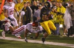 Kendial Lawrence (4) of the Missouri Tigers gets past Jonathan Nelson (3) of the Oklahoma Sooners at Faurot Field/Memorial Stadium on October 23, 2010 in Columbia, Missouri. The Tigers beat the Sooners 36-27. Photo by Dilip Vishwanat/Getty Images ......