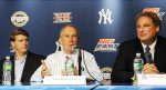 New York City Mayor Michael Bloomberg, center, speaks, as New York Yankees' managing general partner Hal Steinbrenner left, and Yankees' president Randy Levine, right, listen during a news conference, Wednesday, Sept. 30, 2009 at Yankee Stadium in New York. The Big East and Big 12 NCAA college football conferences and the Yankees announced on Wednesday that they have agreed to a four-year deal to play the first bowl in the Bronx since 1962. AP Photo/Stephen Chernin ........