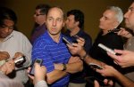 New York Yankees general manager Brian Cashman, center, talks to reporters during a media availability session at the baseball general managers meeting in Lake Buena Vista, Fla., Tuesday, Nov. 16, 2010. AP Photo/Phelan M. Ebenhack ........